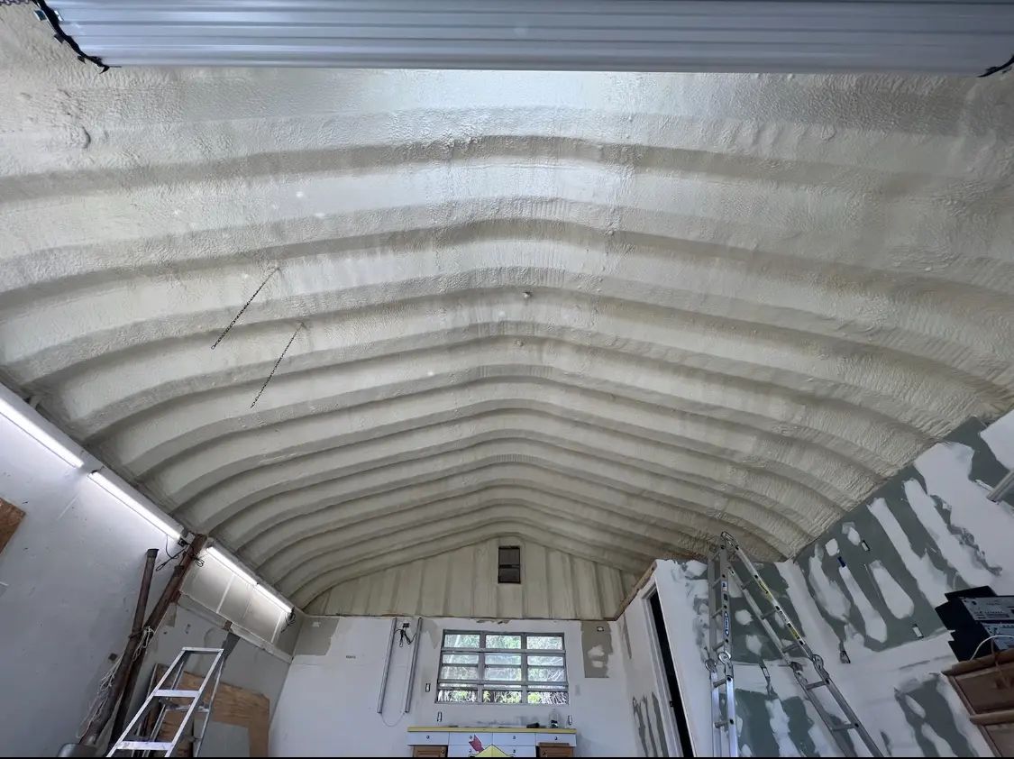 Spray polyurethane foam applied to the underside of a metal roof deck in Cromwell